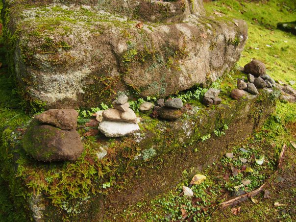 Stones Piled up in front of Jizo