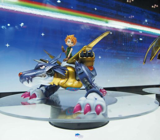 Metal Garurumon and Yamato Ishida from Digimon
